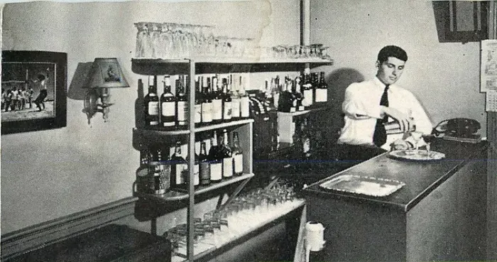 Black-and-white photo of Budge Hall serving cocktails at Windswept in the 1950s