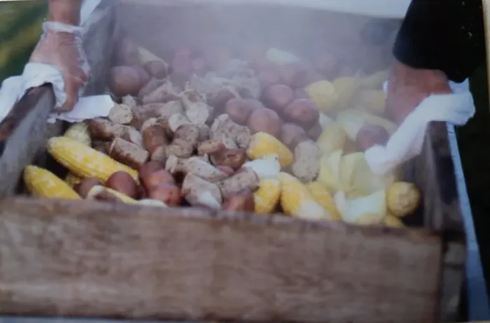 Clambake steaming in a wooden crate