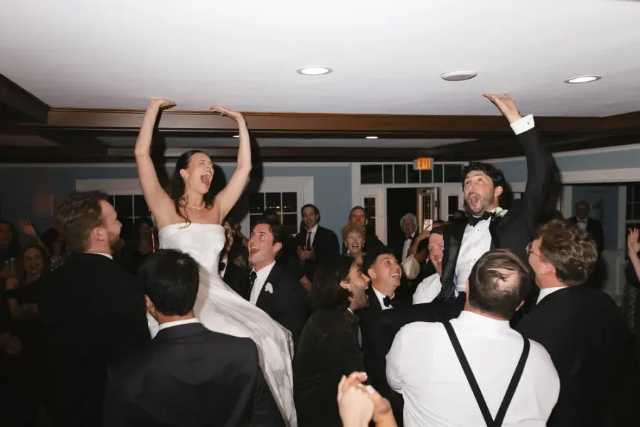 Guests dancing and celebrating the bride