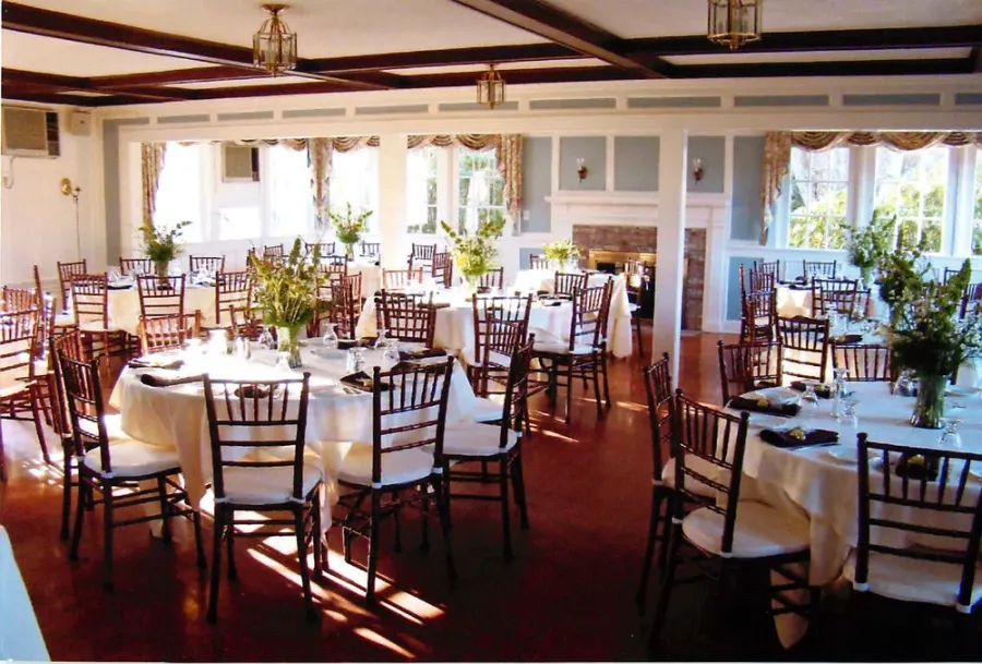 The Great Room with wood beams and wide windows
