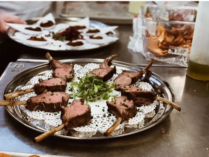 Grilled lamb canapés on a silver tray