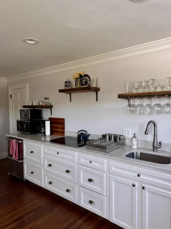 Bridal suite kitchen with white cabinets