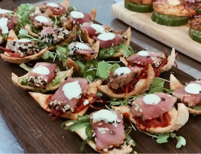Passed hors d’oeuvres on a wooden board